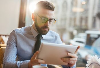 Serious trader looking through financial data online