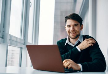 Business man working desk laptop smile communication internet